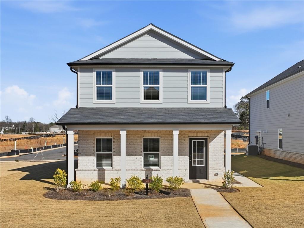 a front view of a house with yard