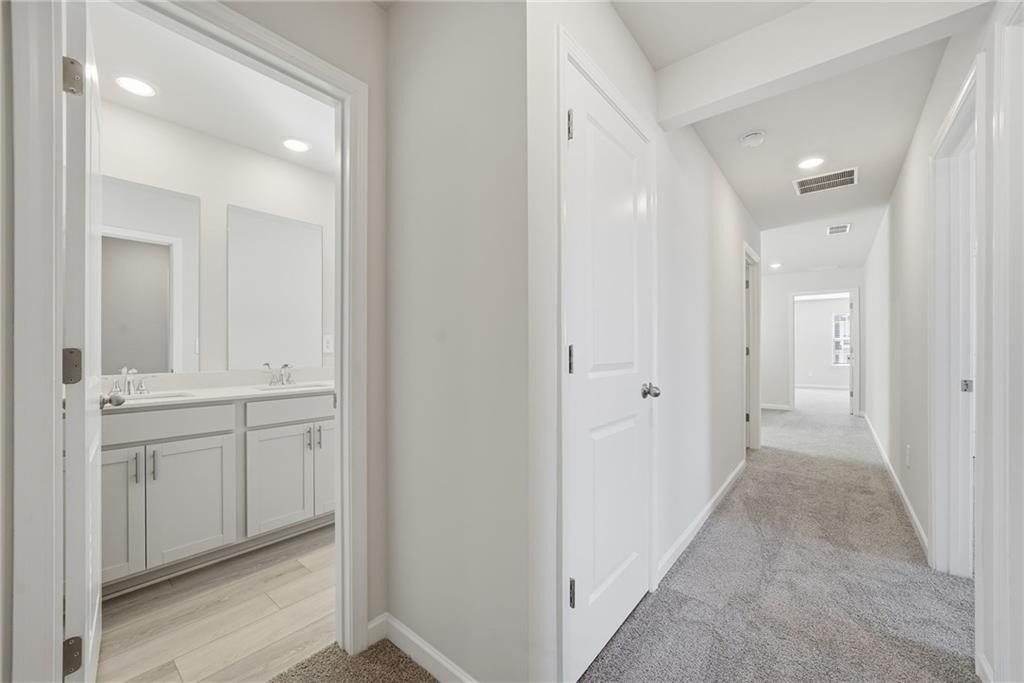 1503 Wild Fox Run Lawrenceville, GA 30045 - Photo 29 of 46 a view of a hallway with wooden floor