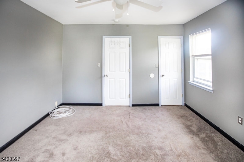 1130 Valley Road, Unit 2B Wayne, NJ 07470 - Photo 26 of 47 an empty room with windows