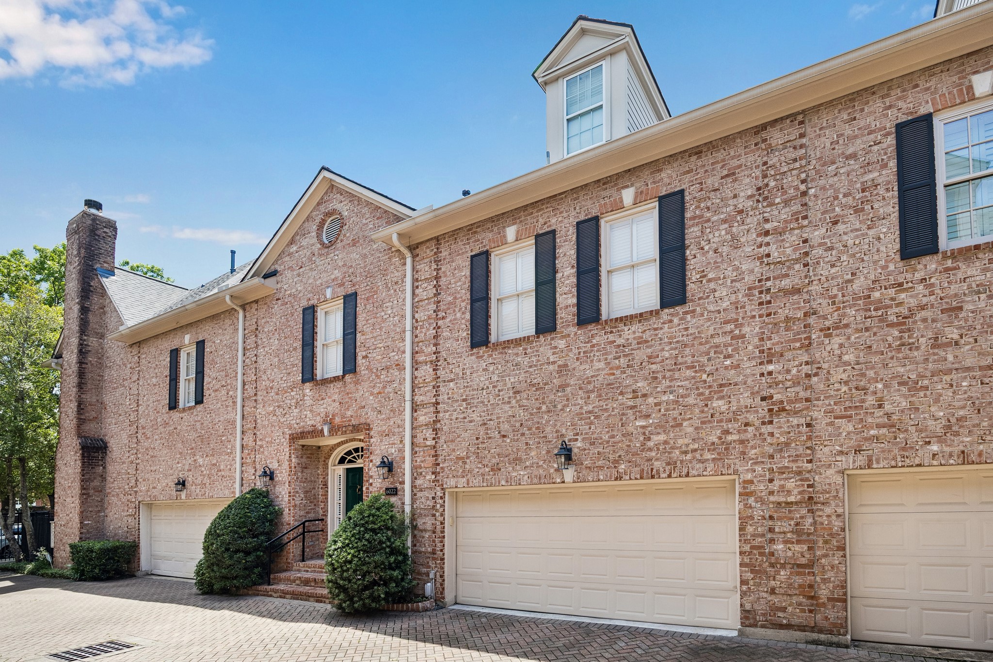 6022 Burgoyne Road Houston, TX 77057 - Photo 29 of 30 Elegant three-story brick residence with classic architectural elements and a stately presence.