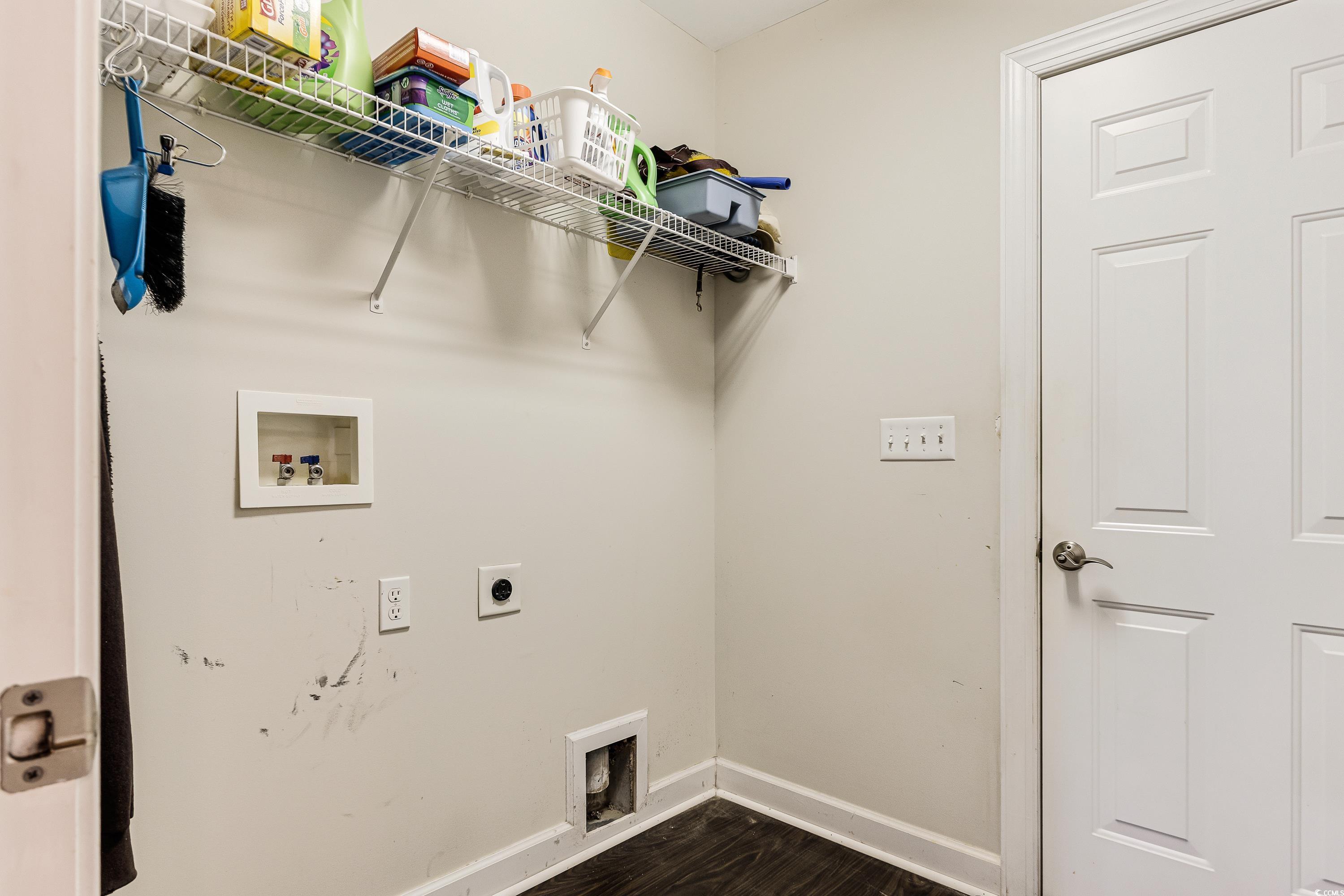 101 Cedar Tree Lane Southwest Calabash, NC 28467 - Photo 24 of 40 Laundry area featuring washer hookup, hookup for an electric dryer, and dark wood finished floors