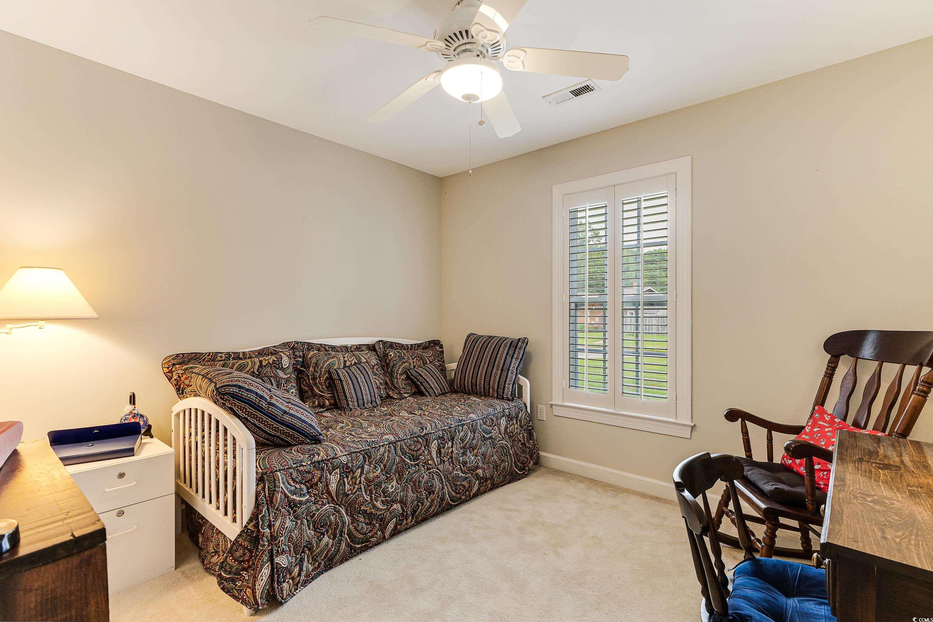 101 Cedar Tree Lane Southwest Calabash, NC 28467 - Photo 25 of 40 Bedroom featuring carpet flooring and a ceiling fan