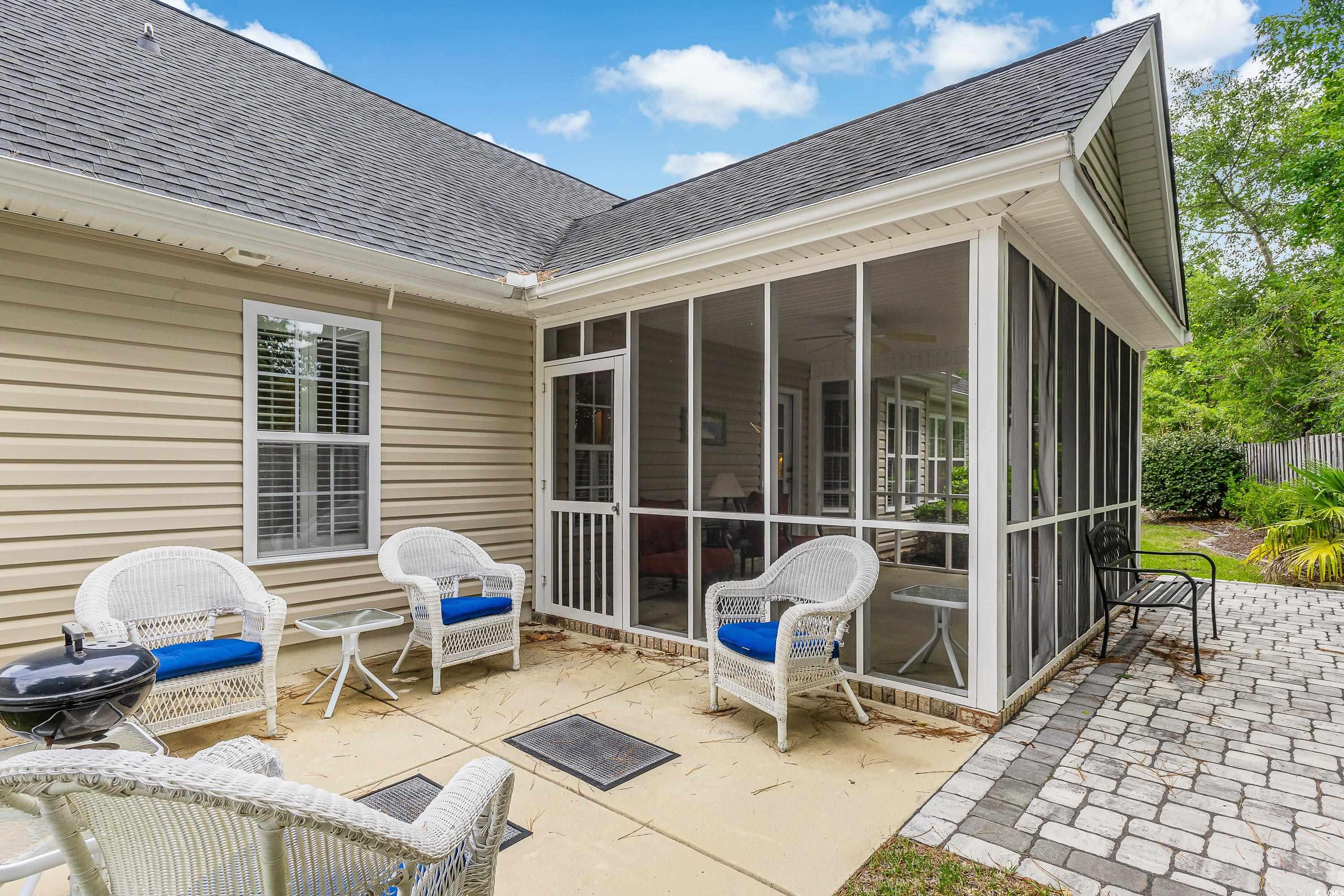 101 Cedar Tree Lane Southwest Calabash, NC 28467 - Photo 32 of 40 View of patio with a sunroom