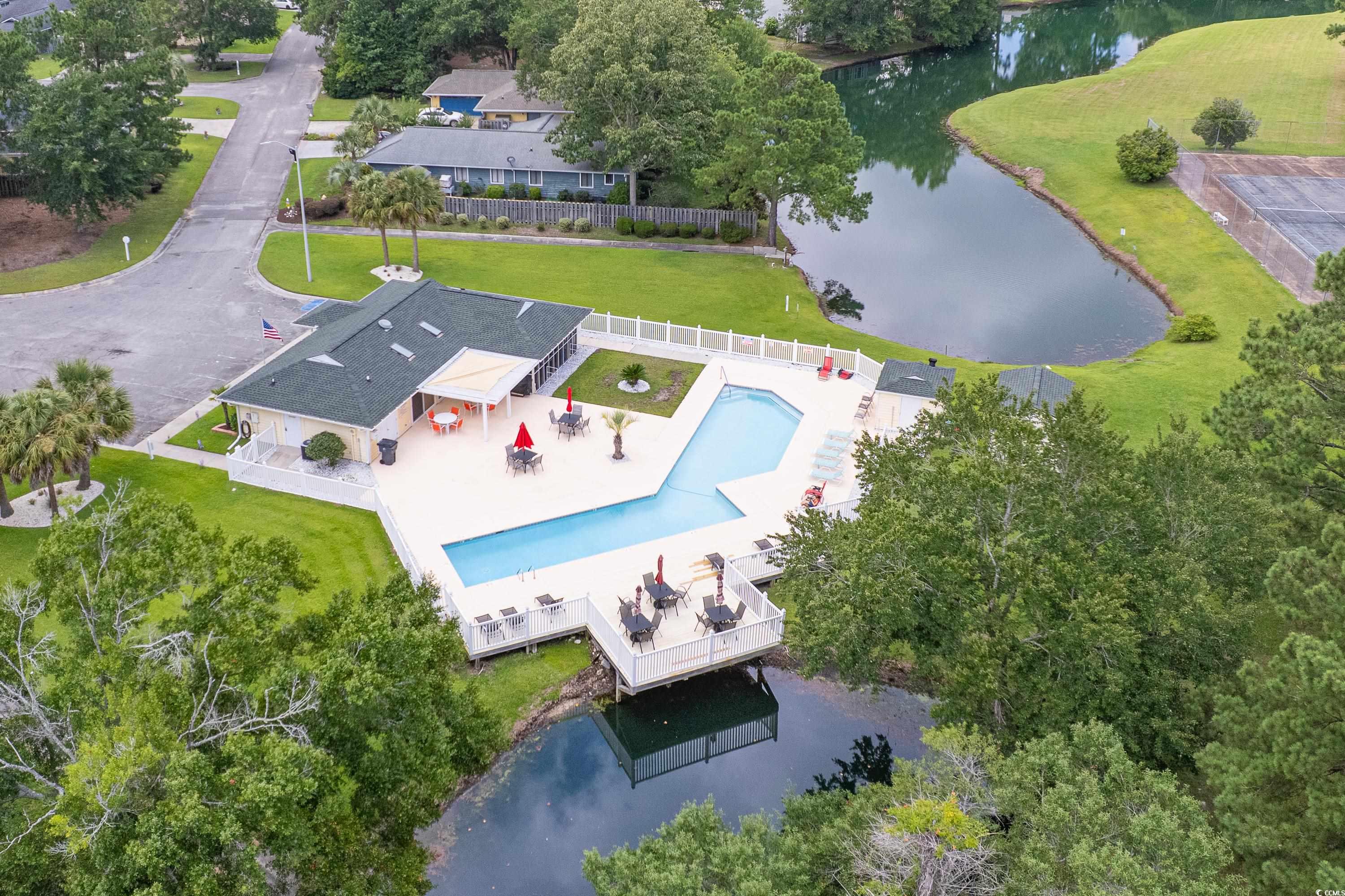 101 Cedar Tree Lane Southwest Calabash, NC 28467 - Photo 40 of 40 Drone / aerial view of a large body of water and a pool