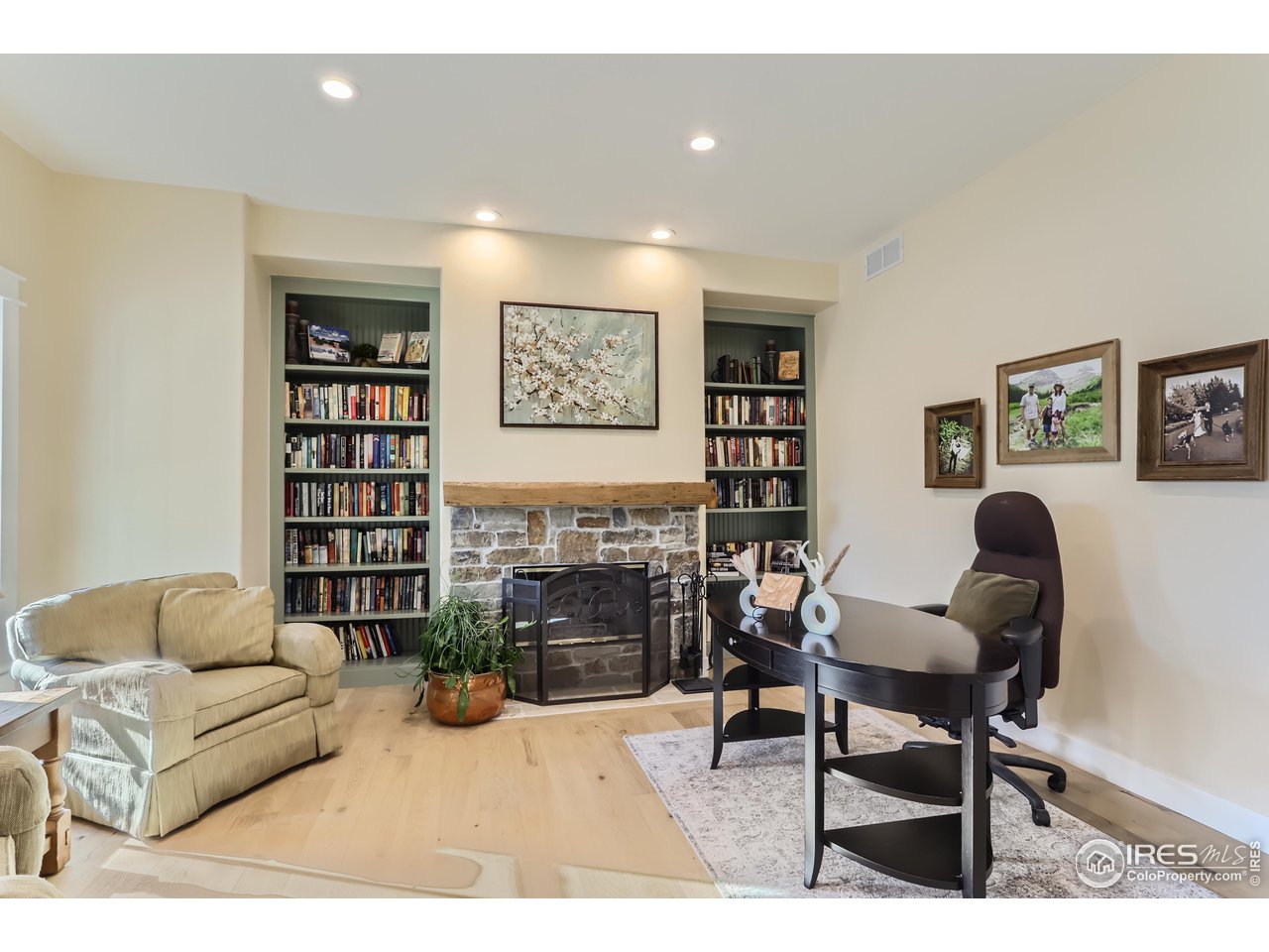 8435 Brittany Place Niwot, CO 80503 - Photo 11 of 40 a living room with furniture and a fireplace