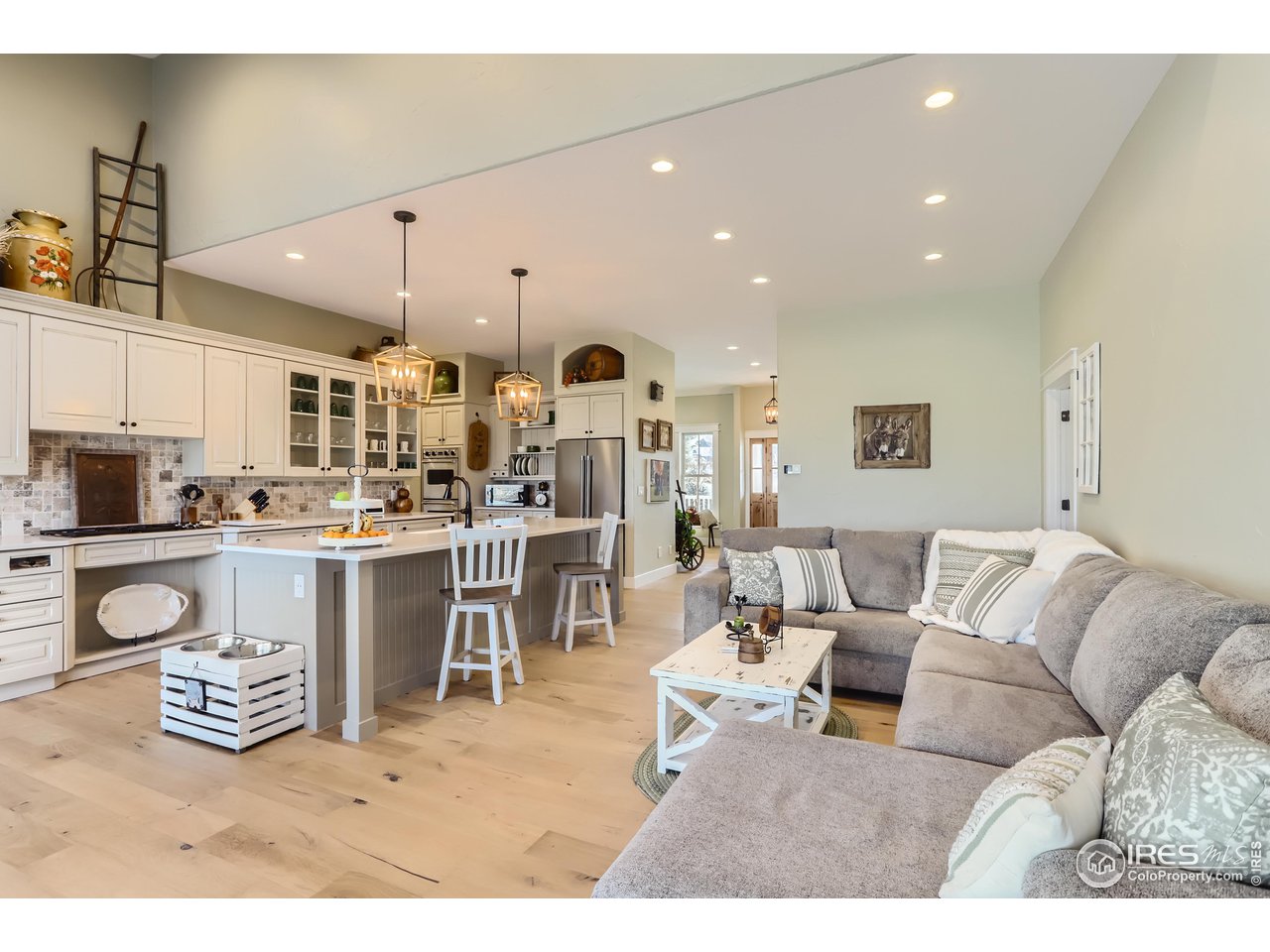 8435 Brittany Place Niwot, CO 80503 - Photo 16 of 40 a living room with lots of furniture and kitchen view