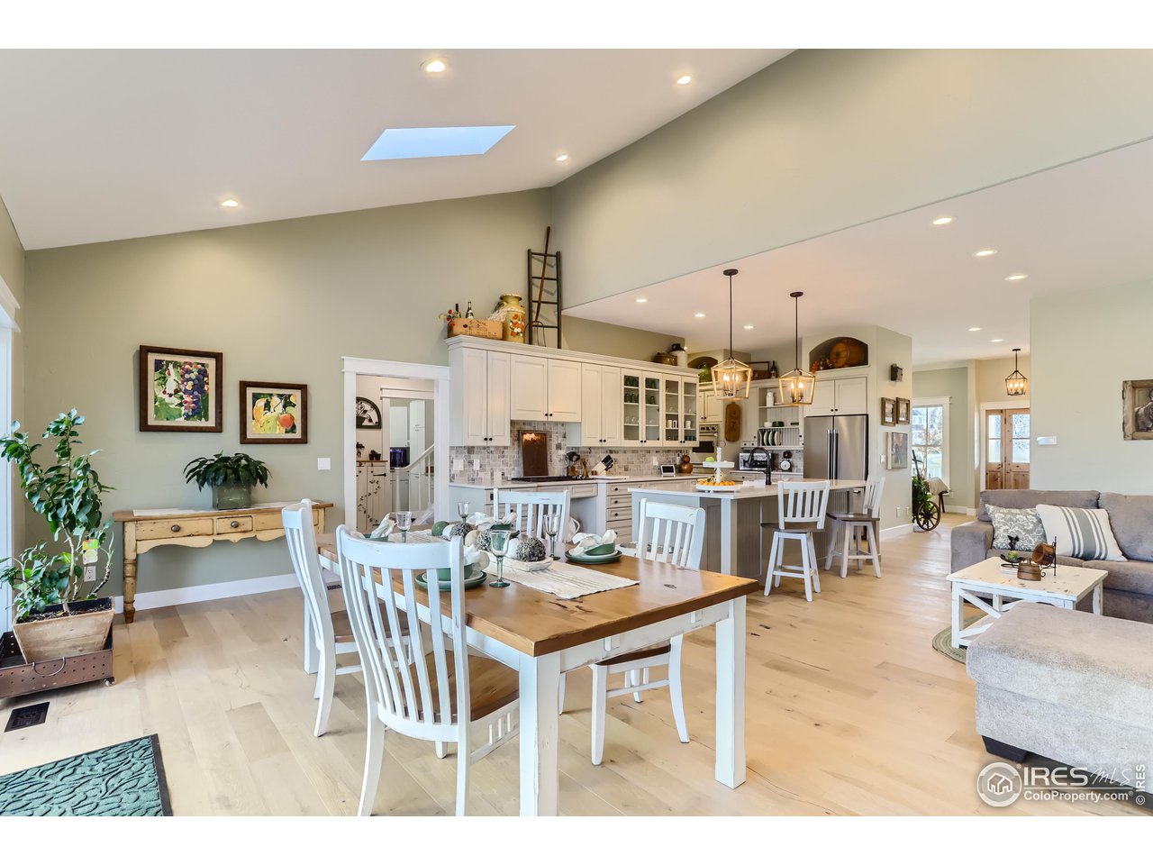 8435 Brittany Place Niwot, CO 80503 - Photo 17 of 40 a living room with lots of furniture and a view of kitchen