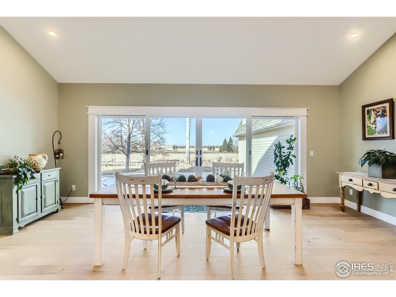 8435 Brittany Place Niwot, CO 80503 - Photo 18 of 40 a dining room with furniture and a large window