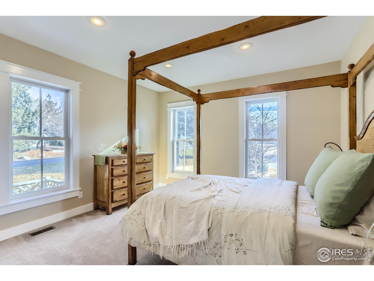 8435 Brittany Place Niwot, CO 80503 - Photo 23 of 40 a bedroom with a bed and a large window