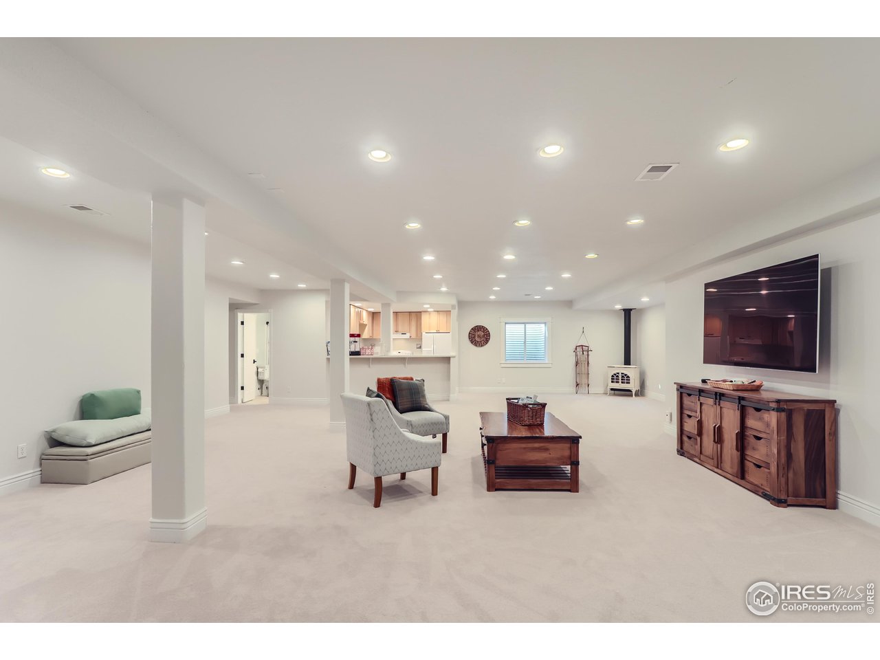 8435 Brittany Place Niwot, CO 80503 - Photo 31 of 40 a living room with furniture and a flat screen tv