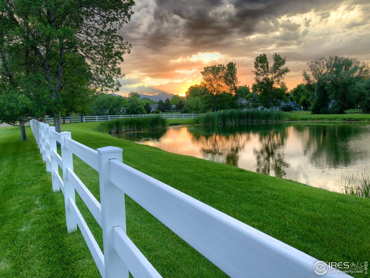 8435 Brittany Place Niwot, CO 80503 - Photo 37 of 40 a view of a lake with a garden