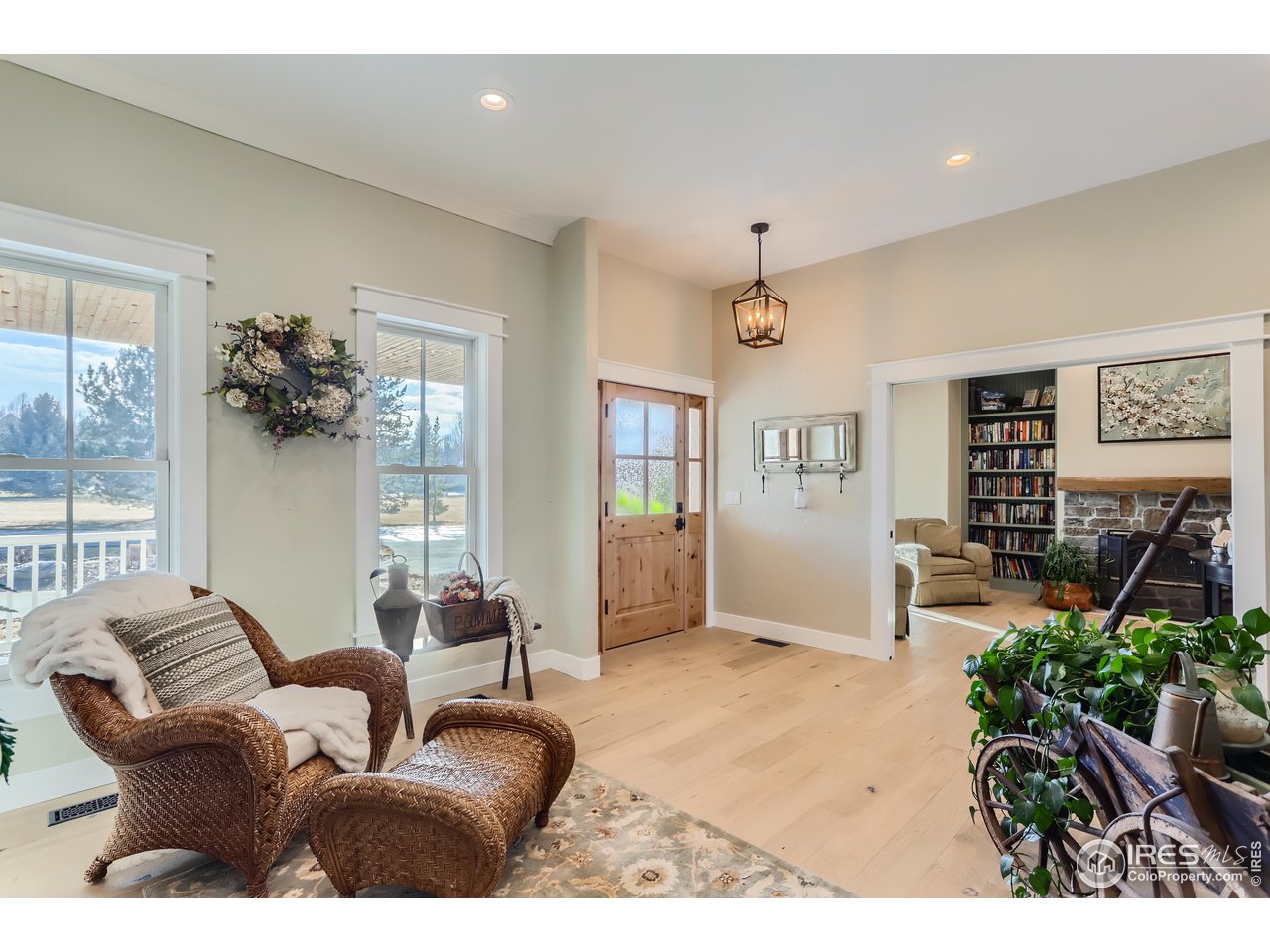 8435 Brittany Place Niwot, CO 80503 - Photo 9 of 40 a living room with furniture flowerpot and wooden floor