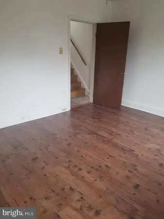 a view of an empty room with stairs