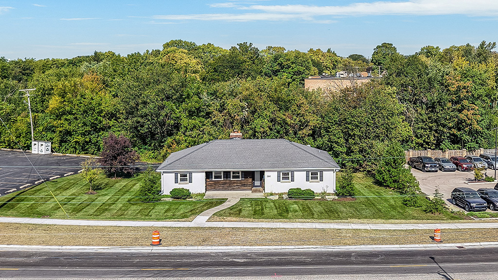 a view of a big yard in front of a house