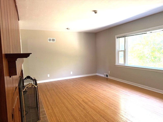 704 East 9th Street Lockport, IL 60441 - Photo 11 of 16 a view of a room with wooden floor and walls