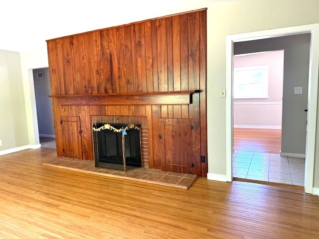 704 East 9th Street Lockport, IL 60441 - Photo 13 of 16 an empty room with wooden floor and windows