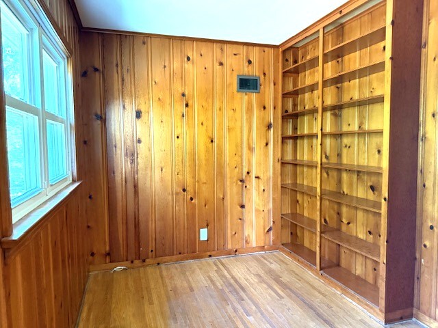 704 East 9th Street Lockport, IL 60441 - Photo 15 of 16 a view of a hallway with wooden walls and windows