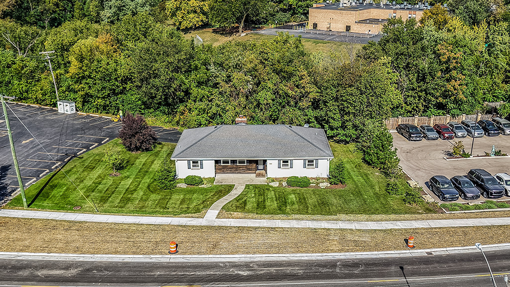 704 East 9th Street Lockport, IL 60441 - Photo 2 of 16 front view of house with a small yard and large trees