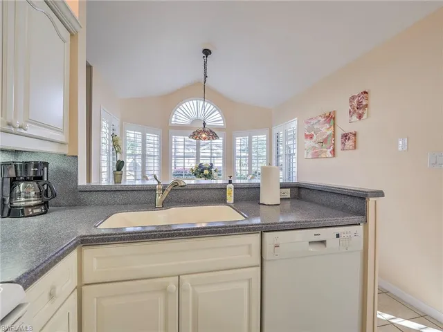 a kitchen with sink and window