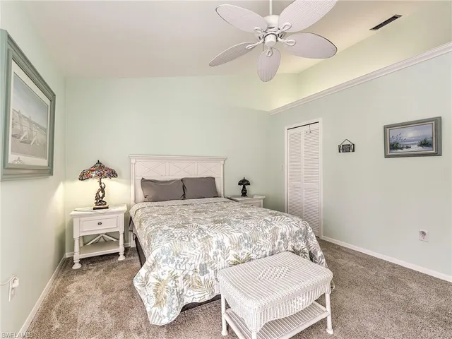 a bedroom with a bed and a table