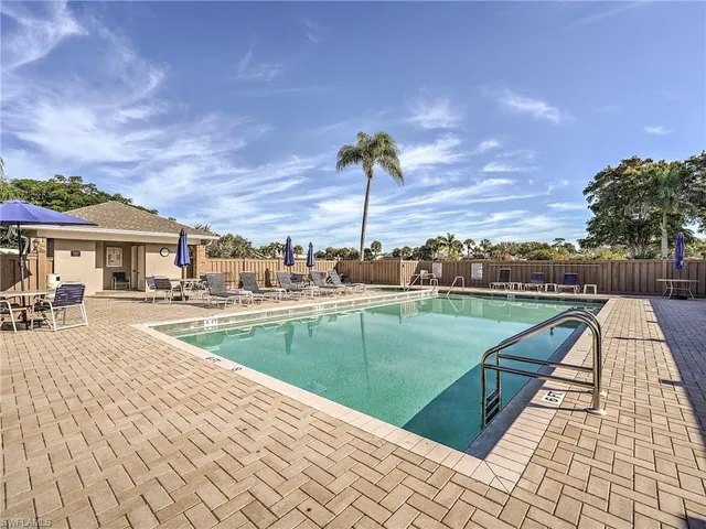 a view of a swimming pool with a lounge chair