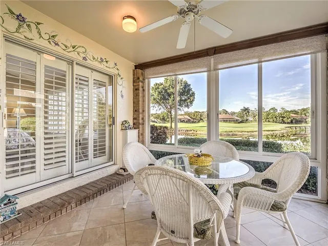 a living room with large windows