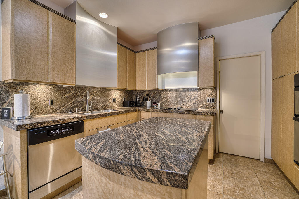 17 Lakeshore Drive Rancho Mirage, CA 92270 - Photo 12 of 23 a kitchen with granite countertop a refrigerator and a stove