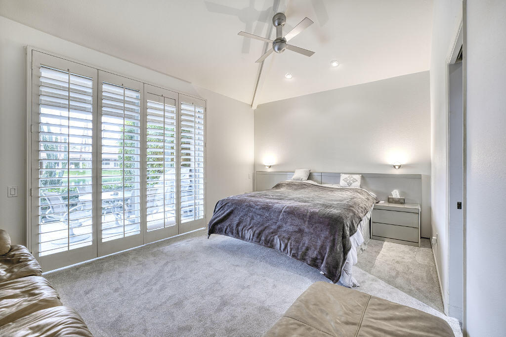 17 Lakeshore Drive Rancho Mirage, CA 92270 - Photo 16 of 23 a spacious bedroom with a large bed and a large window