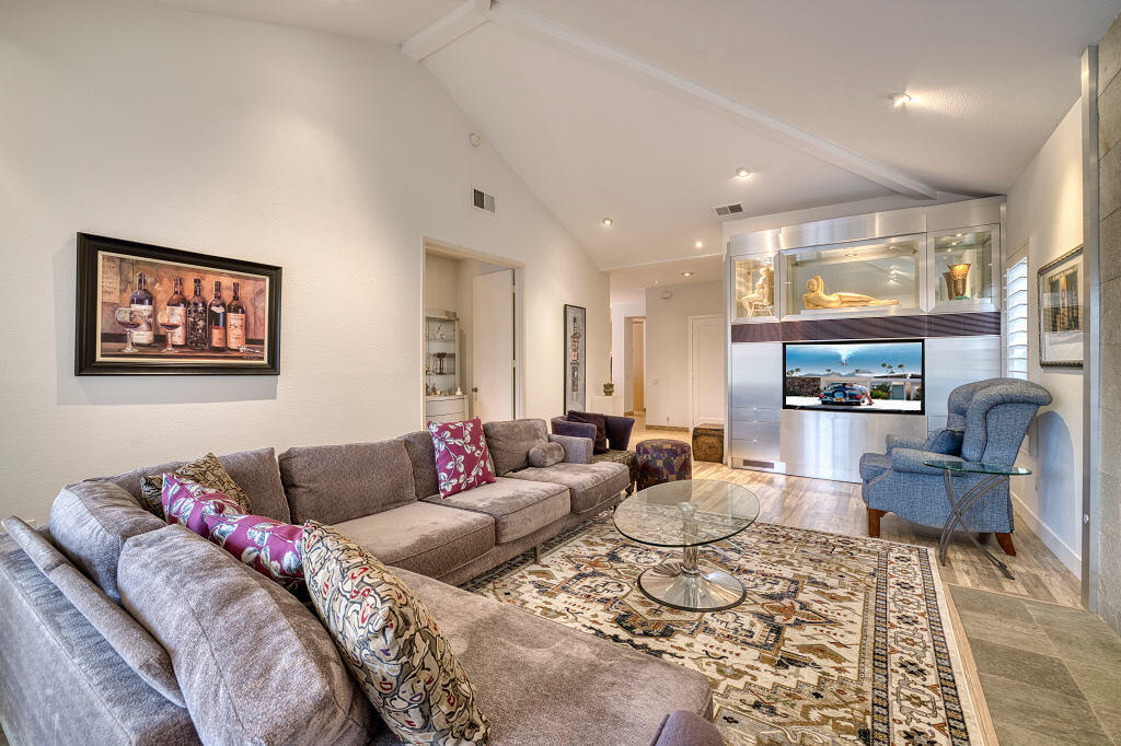 17 Lakeshore Drive Rancho Mirage, CA 92270 - Photo 6 of 23 a living room with furniture and a fireplace