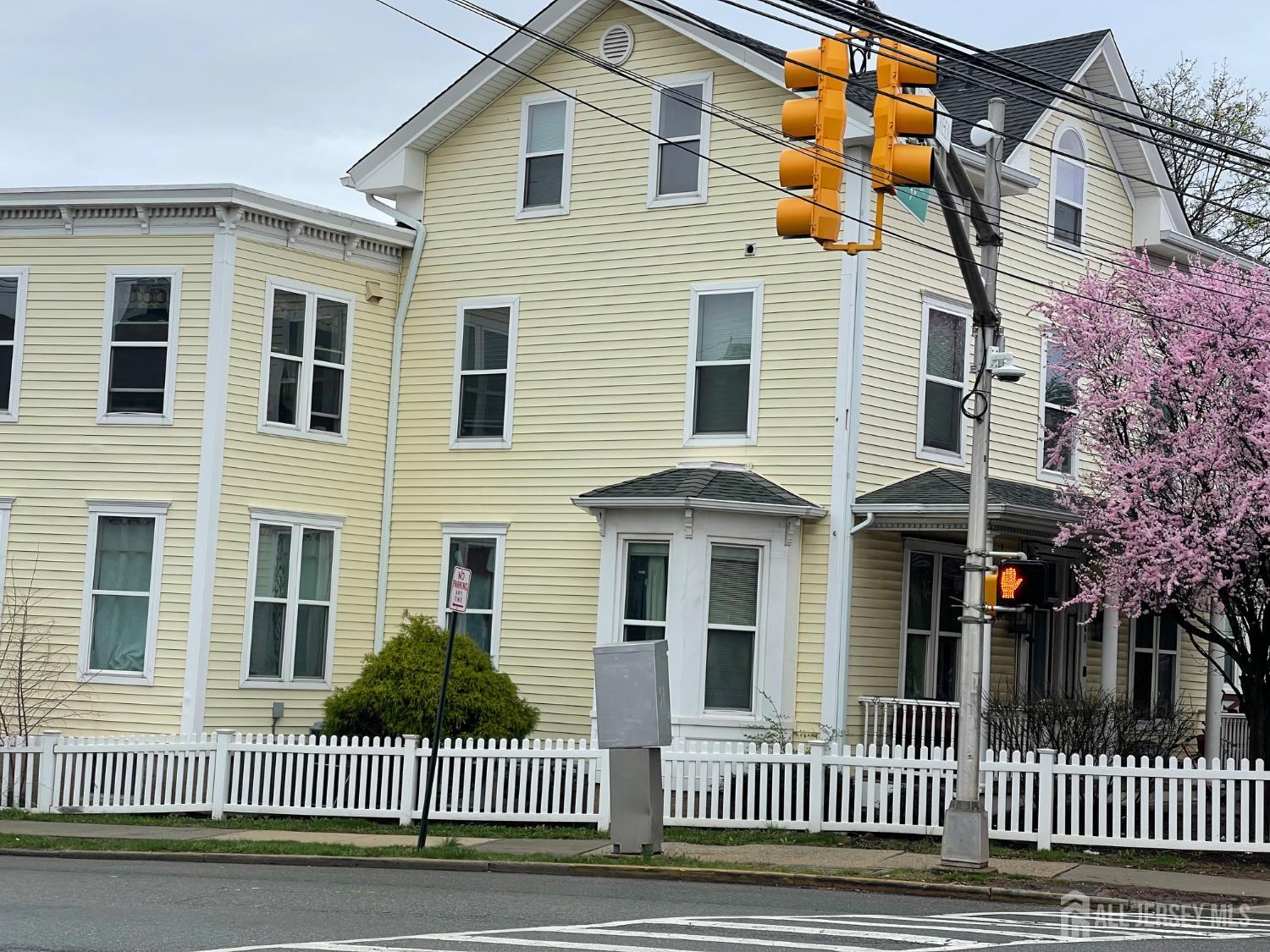 161 George Street New Brunswick, NJ 08901 - Photo 5 of 10 a view of a brick house with a iron gate