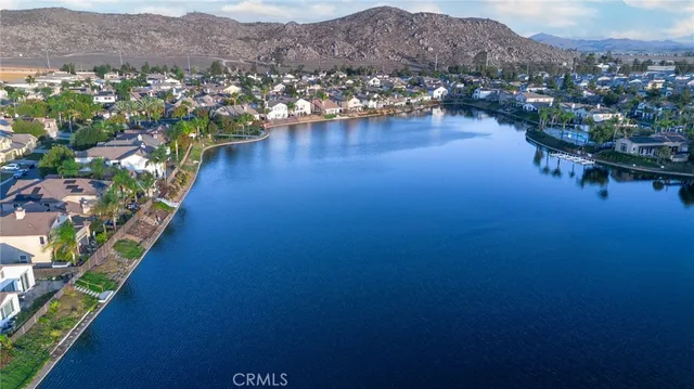 an aerial view of residential houses with outdoor space and river