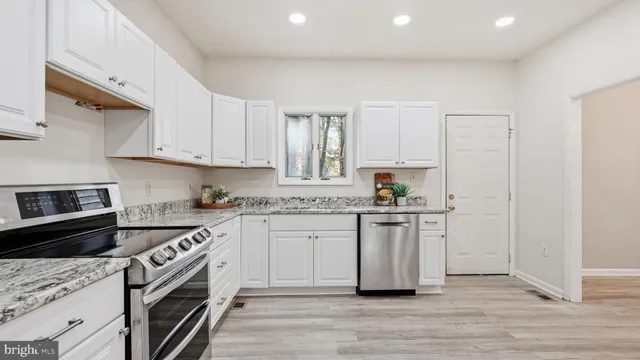 a bathroom with a sink a toilet and a bathtub
