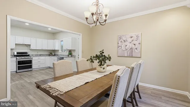 a view of a livingroom with a ceiling fan and window