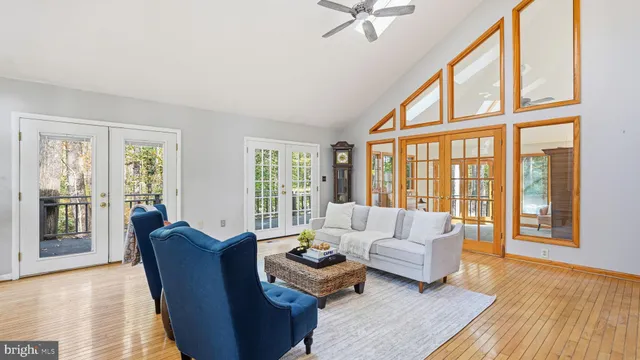 a bed sitting in a spacious bedroom next to a window