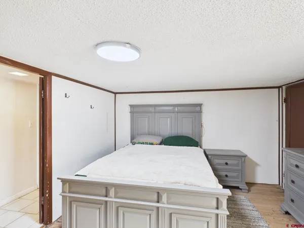 a bedroom with a bed and a table