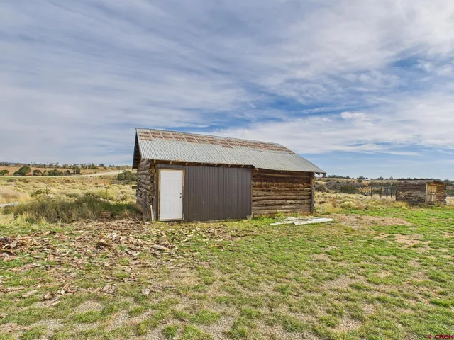 a view of a field with an ocean