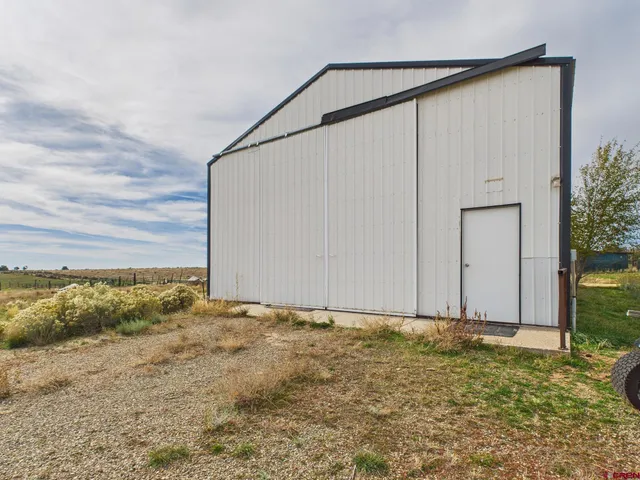 a view of a back yard of the house