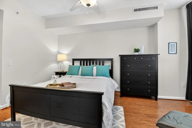 a bed room with a bed and a dresser