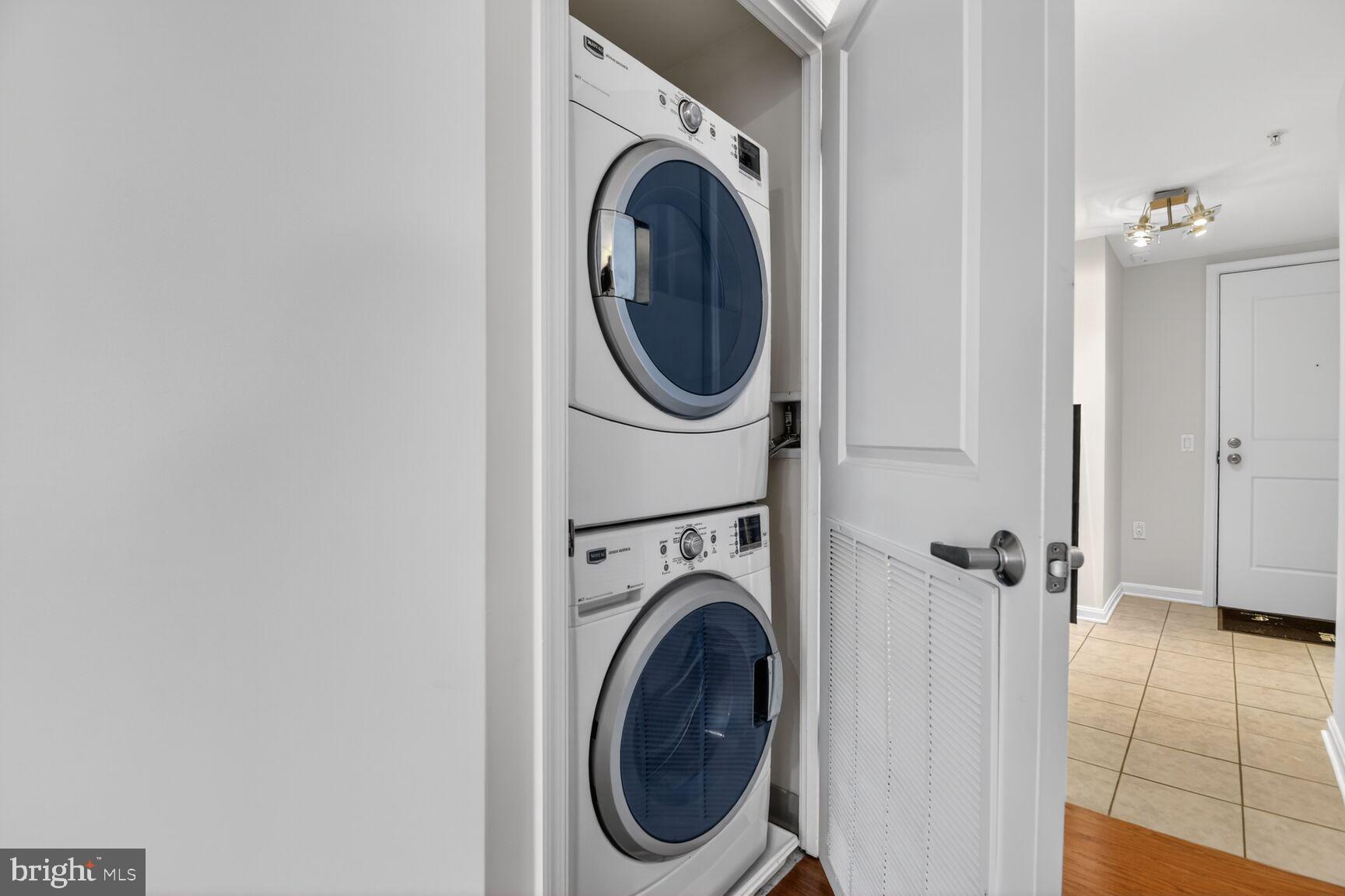 930 Wayne Avenue, Unit 405 Silver Spring, MD 20910 - Photo 23 of 37 a utility room with dryer and washer