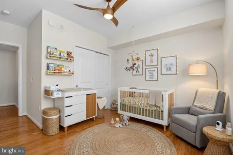 a room with wooden floor and gym equipment
