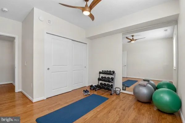 a work room with furniture and wooden floor