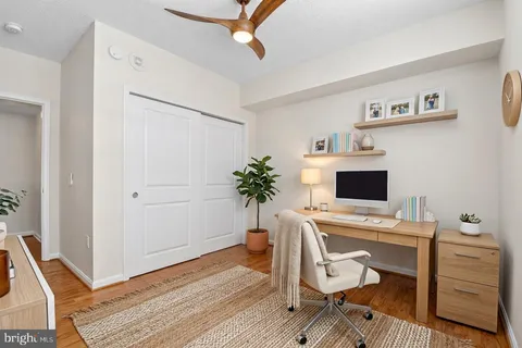 a work room with furniture and wooden floor