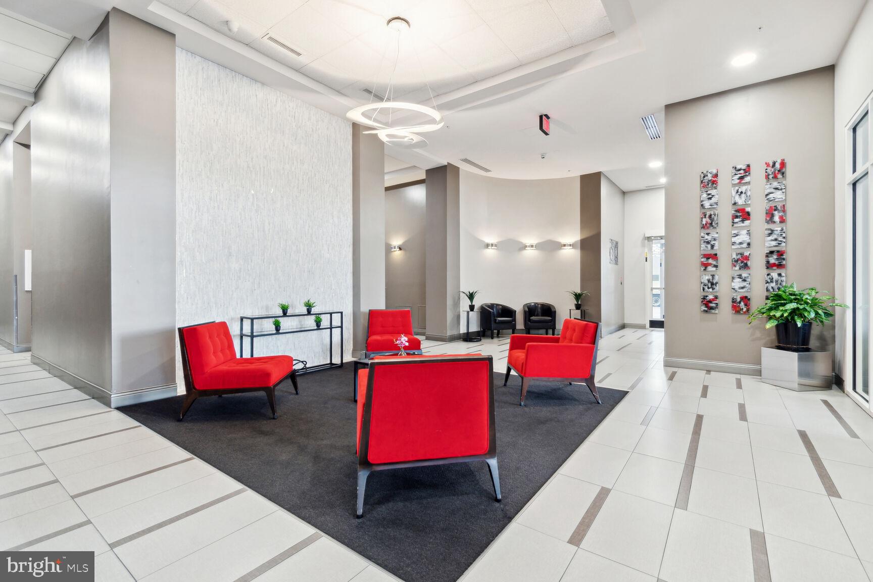 930 Wayne Avenue, Unit 405 Silver Spring, MD 20910 - Photo 27 of 37 a living room with furniture pool table and windows