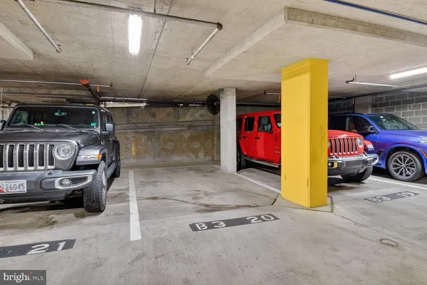 a living room with furniture pool table and windows