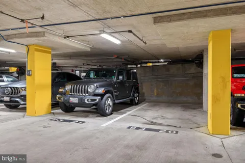 a living room with furniture pool table and windows