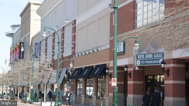 a view of a street with benches