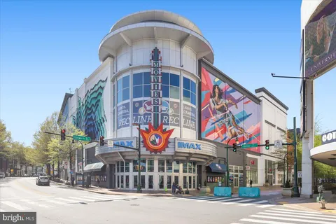a outdoor view of a building with traffic signal lights
