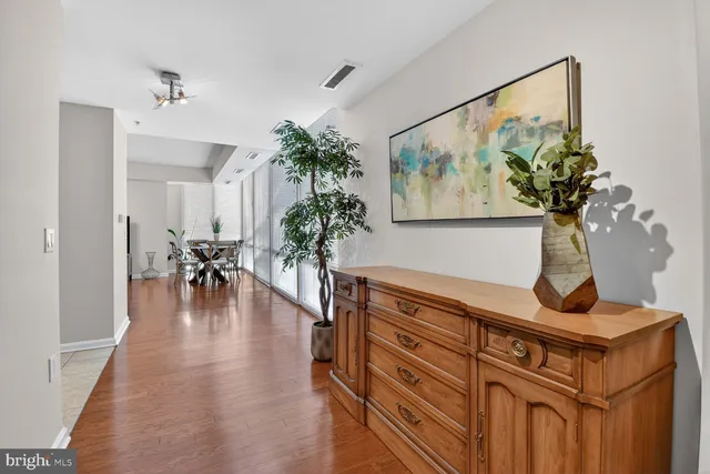 a view of dining room with furniture wooden floor and a chandelier