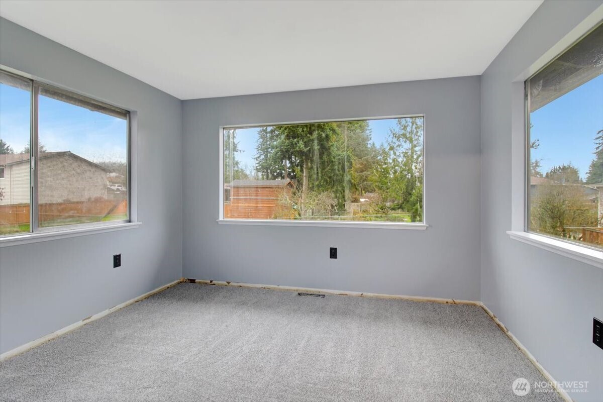 7313 228th Street Southwest Mountlake Terrace, WA 98043 - Photo 12 of 34 an empty room with a window