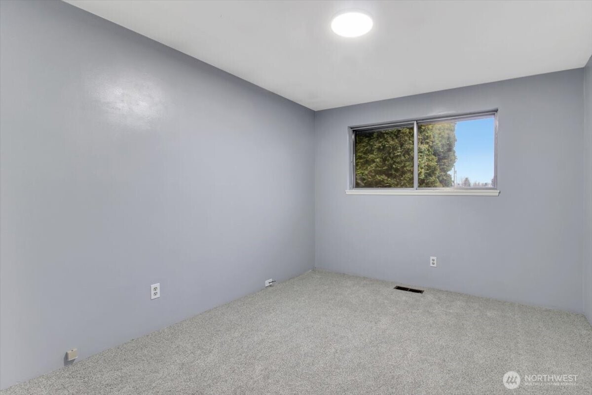 7313 228th Street Southwest Mountlake Terrace, WA 98043 - Photo 16 of 34 an empty room with windows